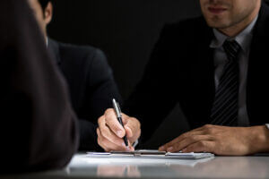 Businessmen in formal attire reviewing